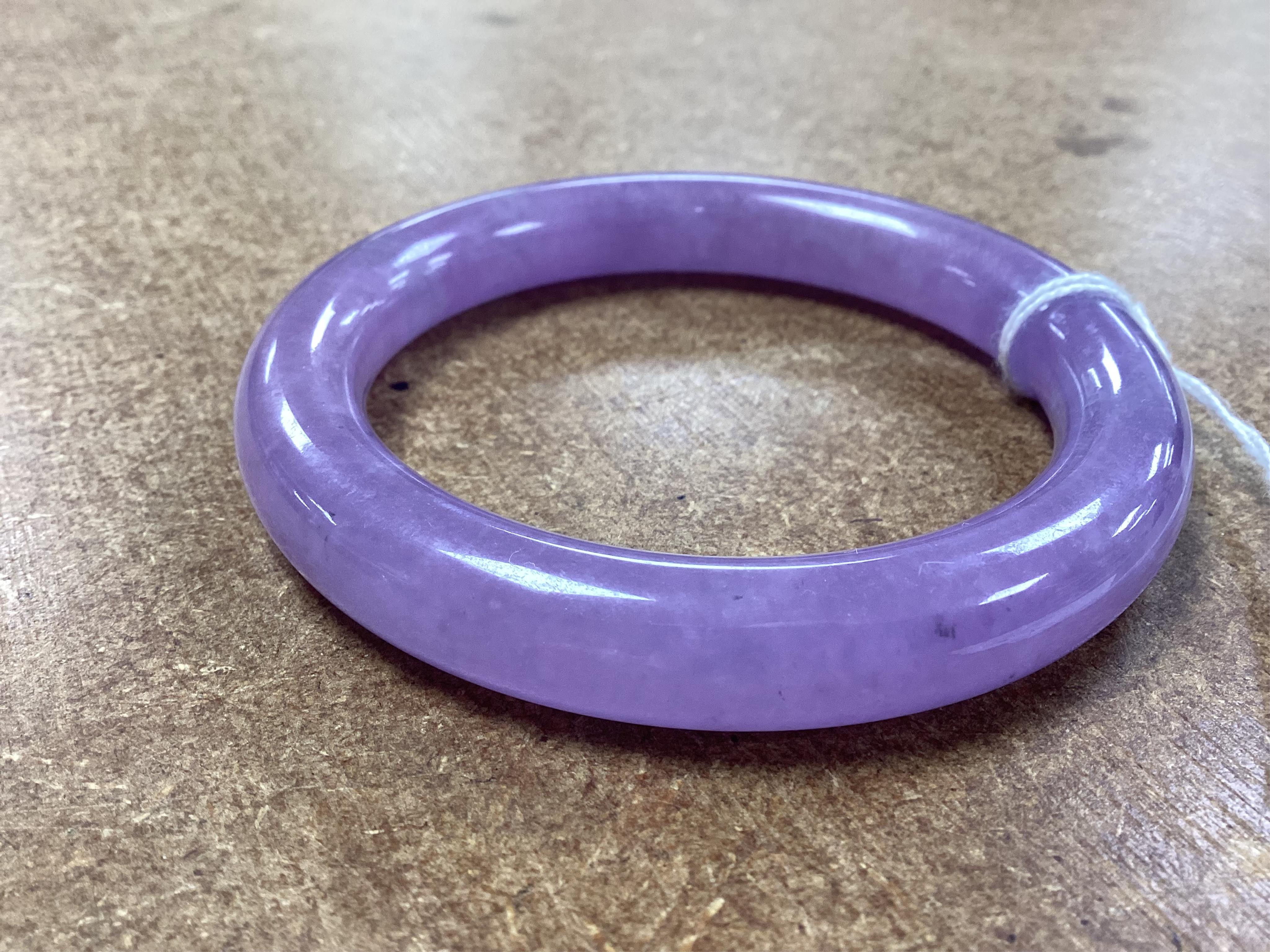 A lavender hardstone bangle, 8cm wide